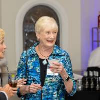 Female guest smiling at someone off camera